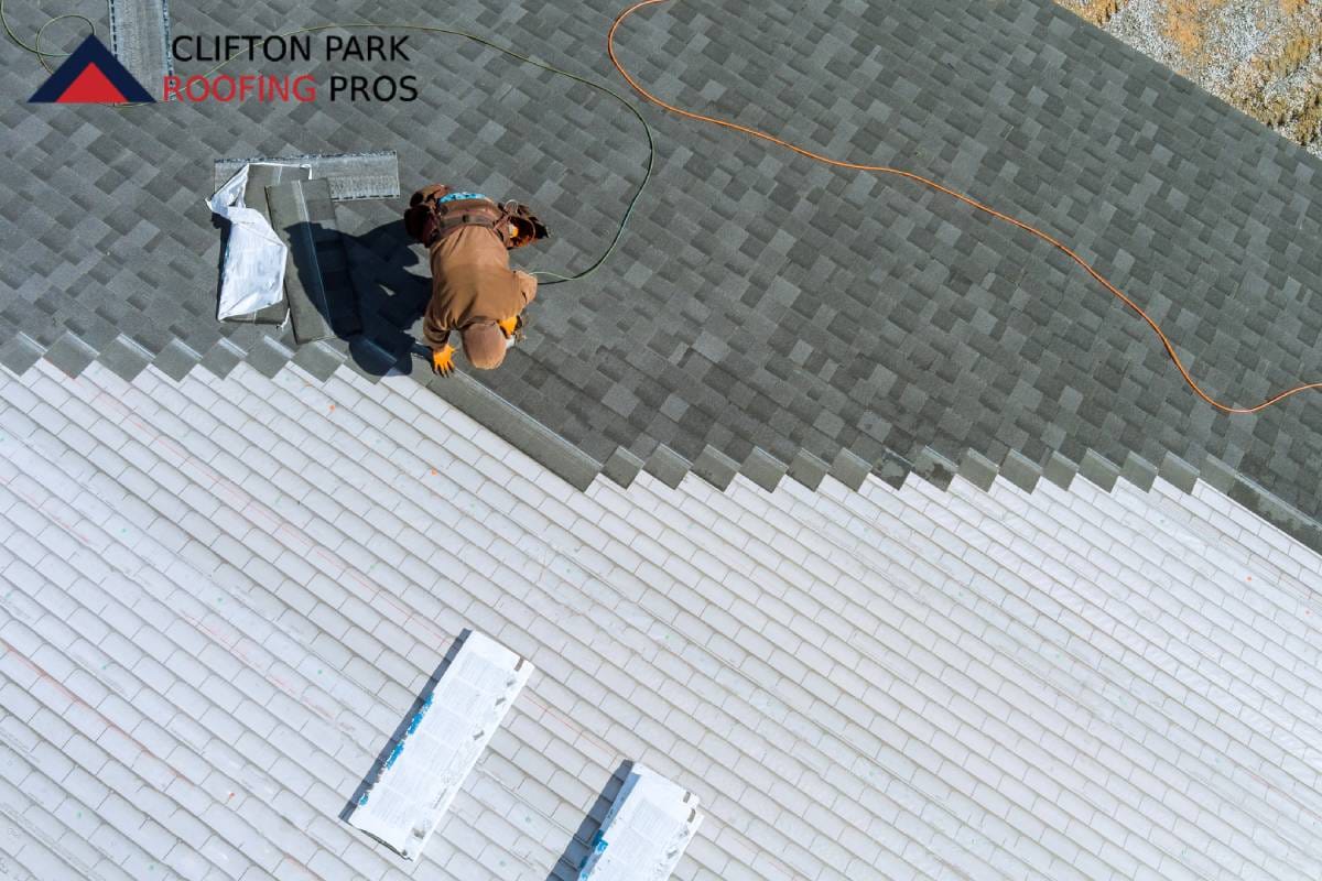 Roofer documenting storm damage for NY insurance claim